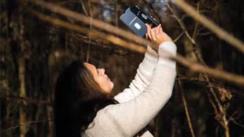 Prof. Annette Menzel takes a picture of a tree